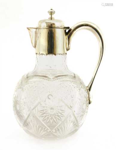 A silver-mounted cut glass claret jug,