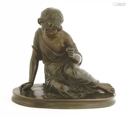 A bronze of a seated girl