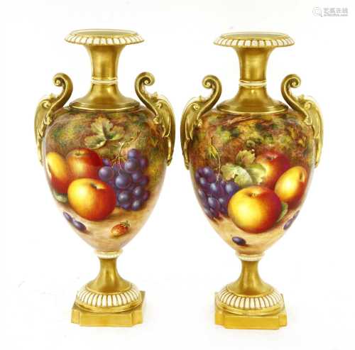 A pair of Royal Worcester urn-shaped vases