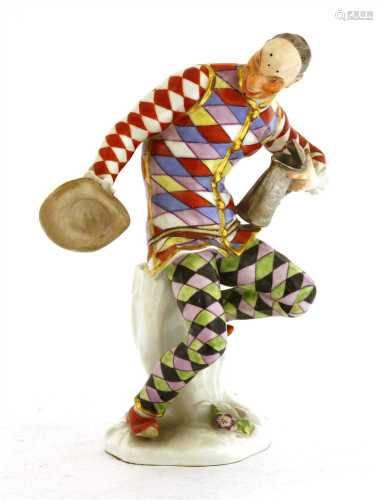 A Meissen figure of an harlequin,