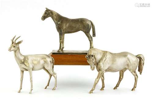 Two silver horse figures