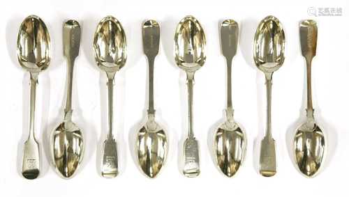 A set of twenty-four Victorian silver fiddle pattern dessert spoons,