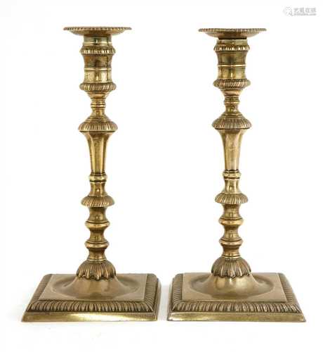 A pair of George II silver candlesticks