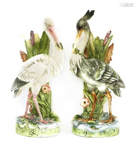 A pair of majolica pottery stick stands