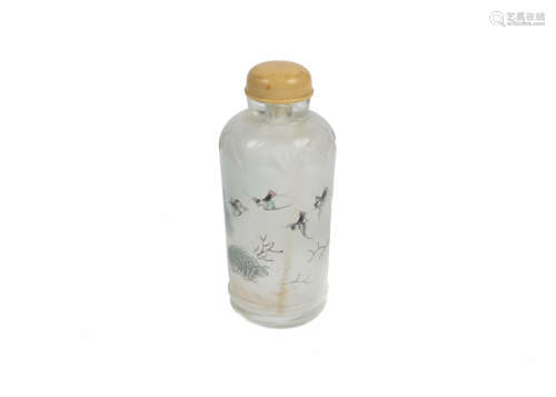A Chinese reverse painted glass snuff bottle, decorated with landscape scene, 8.5 cm high