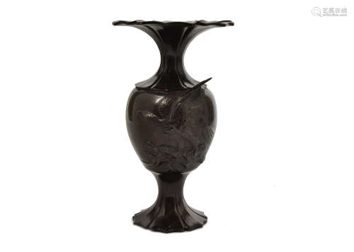 A Japanese bronze vase, baluster form, flared rim, high relief eagle decoration, marked to base,