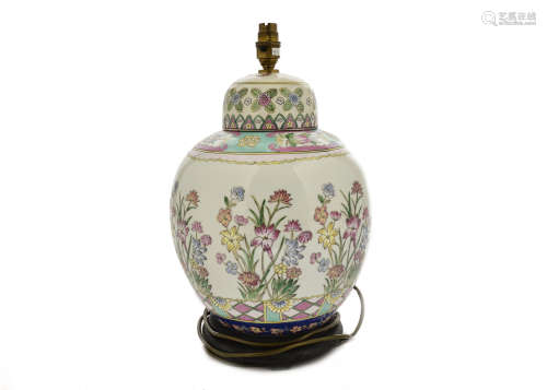 A Chinese famille rose porcelain lamp base, floral decoration, wooden base, 42 cm high including