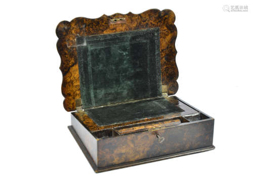 A 19th Century papier mache writing slope in the Gothic style, resembling oyster wood, with brass