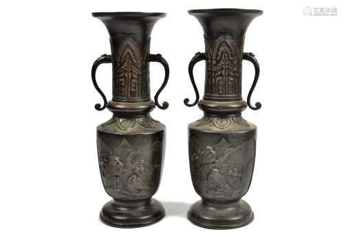 A pair of Chinese bronzed twin-handled vases, each with relief bird decoration to bodies, 33.5 cm