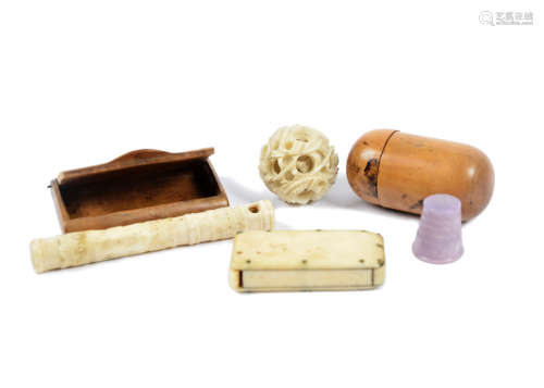 A Meiji period carved ivory puzzle ball, together with an ivory string holder, a wooden vesta