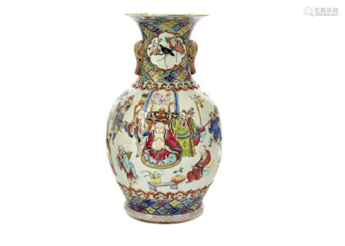 A late Qing period porcelain famille rose baluster vase, twin elephant head handles, body with