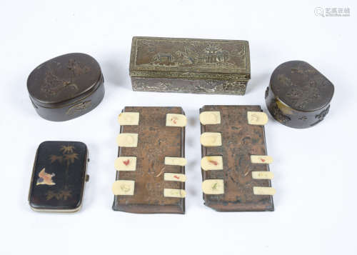 A pair of late 19th Century Japanese copper and ivory whist markers, 9.5 cm wide; together with