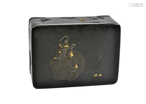 A Japanese takamaki-e decorated metal box, with scholar sitting on an elephant to lid, foliate