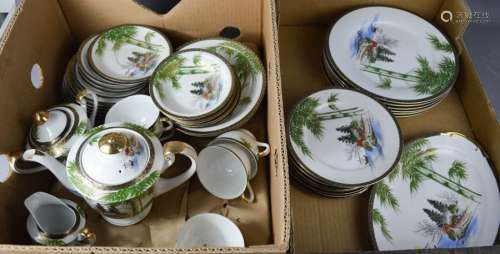 A Chinese tea service, tea pot, hot water, cups, saucers, plates and platters.