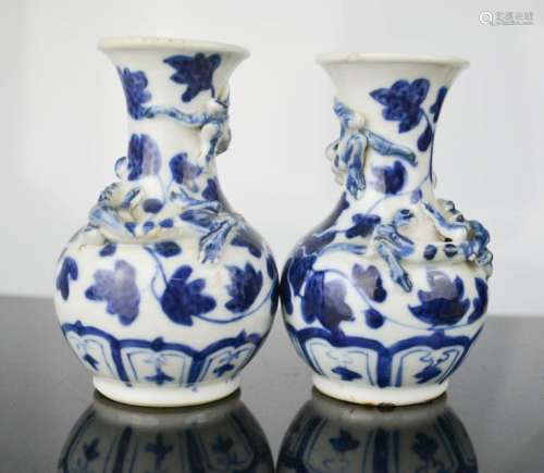 A pair of miniature blue and white Chinese vases, 10cm high.