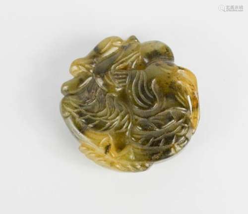 A Chinese carved jade pendant figure and dragon.