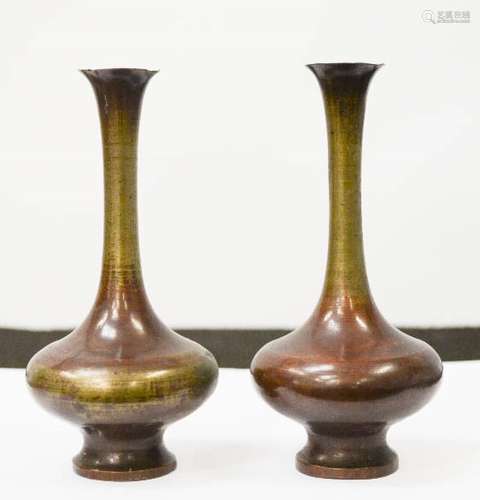 A pair of Chinese bronze vases, with residual deep red patination, 13cm high.