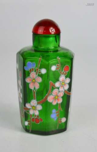 A Chinese green glass scent bottle, painted with flowers.
