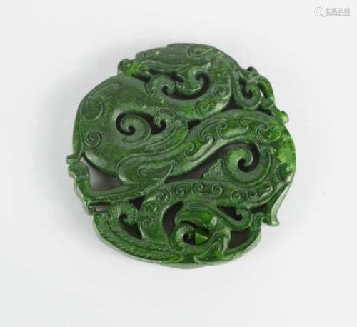 A Chinese carved Nephrite green jade dragon pendant.