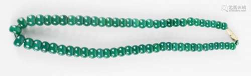 A Chinese Heitian heavy green jade bead necklace, having miau silver screw clasp.