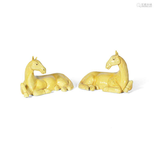 19th century A pair of yellow-glazed models of horses