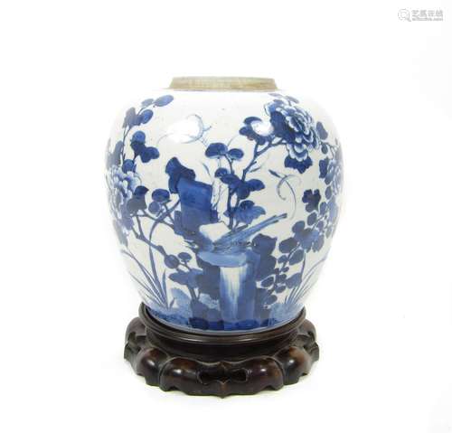 Kangxi period A blue and white jar with wood stand