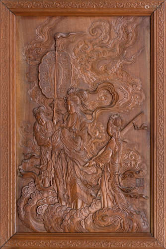 Meiji Era, late 19th century A carved wood panel of Kannon and attendants