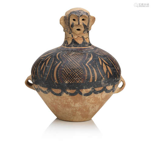 A painted terracotta effigy jar