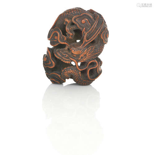 By Toyomasa, Meiji Era An openwork 'dragon' netsuke