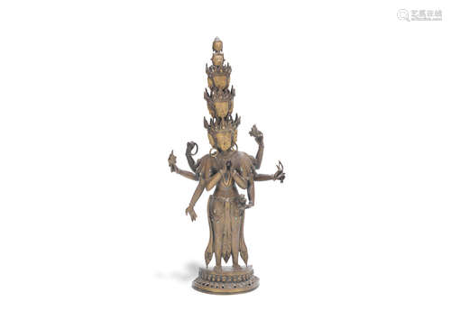 Nepal, 20th century A large turquoise-inlaid brass alloy figure of eleven-headed Avalokiteshvara