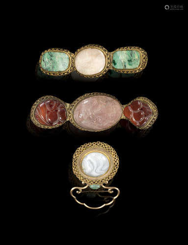 Qing Dynasty A group of three gilt-filigree hardstone-inset belt buckles