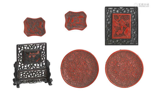 19th/20th century A pair of carved cinnabar 'sages' lacquer dishes, two carved lacquer-inset table screens, and a pair of circular dishes