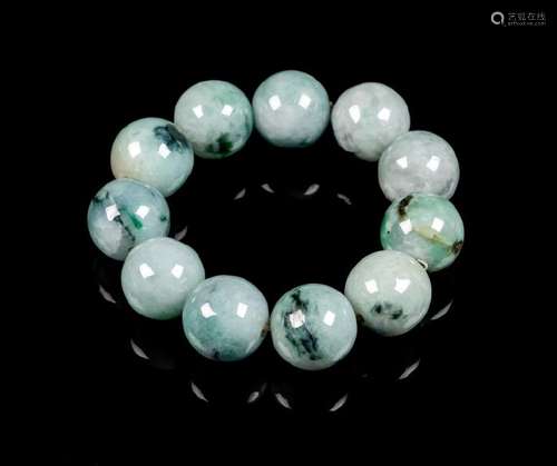 A Chinese Jadeite Beaded Bracelet comprising eleven