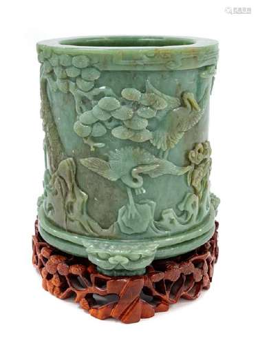 A Chinese Celadon Jade Cylindrical Brushpot raised on