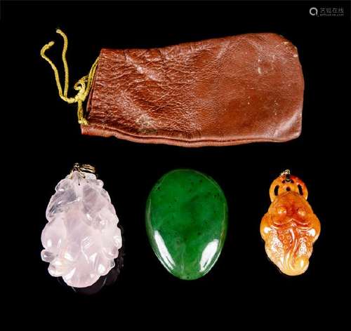 Three Chinese Hardstone Pendents comprising a russet