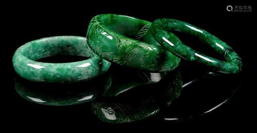 Three Chinese Green Jade and Jadeite Bangles the first