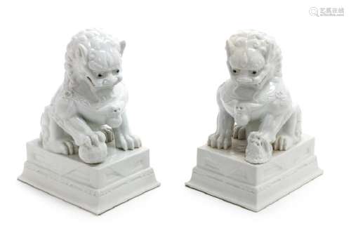 A Pair of Chinese Blanc-de-Chine Figures of Fu Lions