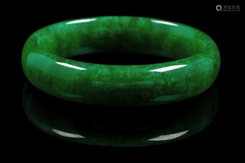 A Chinese Green Jadeite Bangle of semi-cylindrical