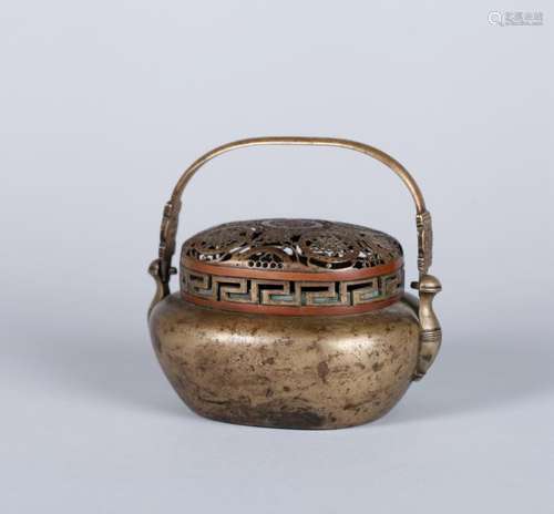 A CHINESE BRONZE HAND WARMER,