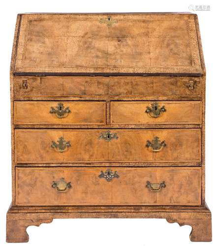 An early 18th Century walnut and cross and feather banded bureau:,