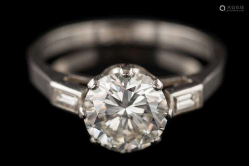 A diamond single-stone ring: the round brilliant-cut diamond approximately 7.3mm diameter x 4.