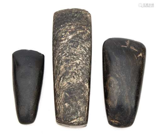 A group of three European Neolithic polished stone axe heads, circa 350 BC:.