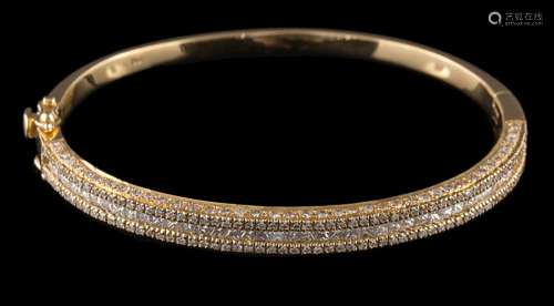 A diamond mounted hinged bangle: with central row of princess-cut diamonds between rows of round