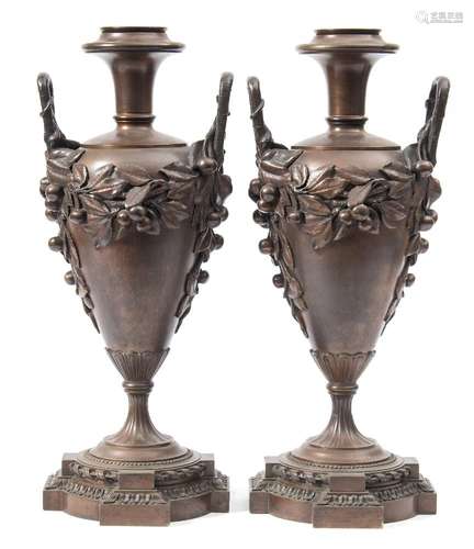 A pair of bronze twin-handled urn lamps: of ovoid tapering form,