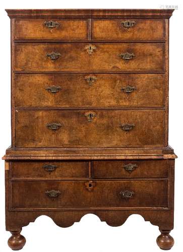 An early 18th Century walnut and crossbanded chest on stand:, the upper part with a moulded cornice,