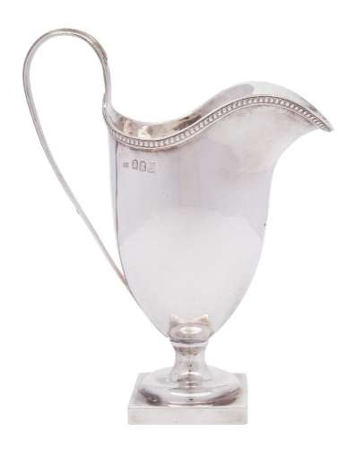 An Edward VII Britannia silver cream jug, maker Maurice Freeman, London,