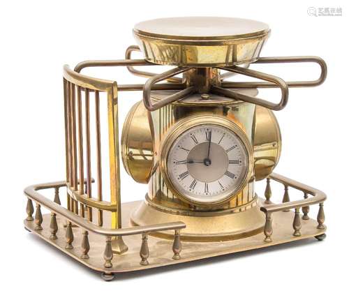 A French brass turnstile combined clock,