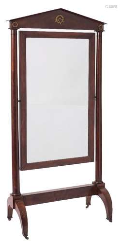 A French Empire mahogany swing frame cheval mirror:, with an architectural pediment,