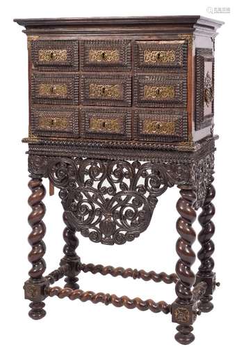 A 19th Century Portuguese carved hardwood ripple moulded cabinet on stand:, with a moulded cornice,