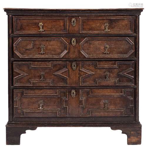 A Jacobean oak rectangular chest:, the top with a moulded edge,